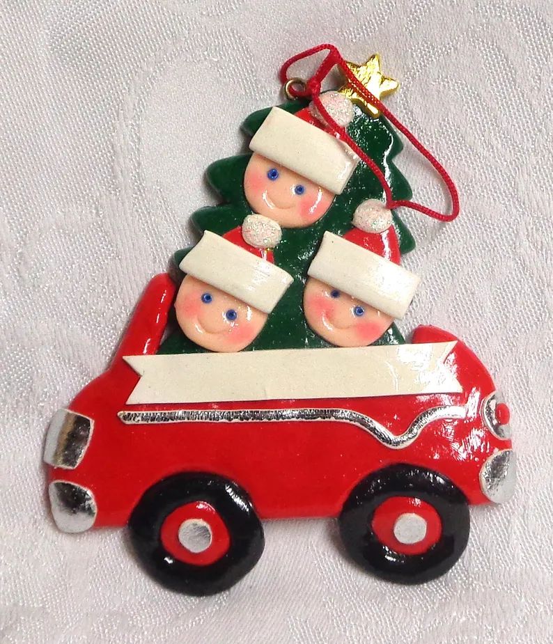 family-riding-in-car-hanging-christmas